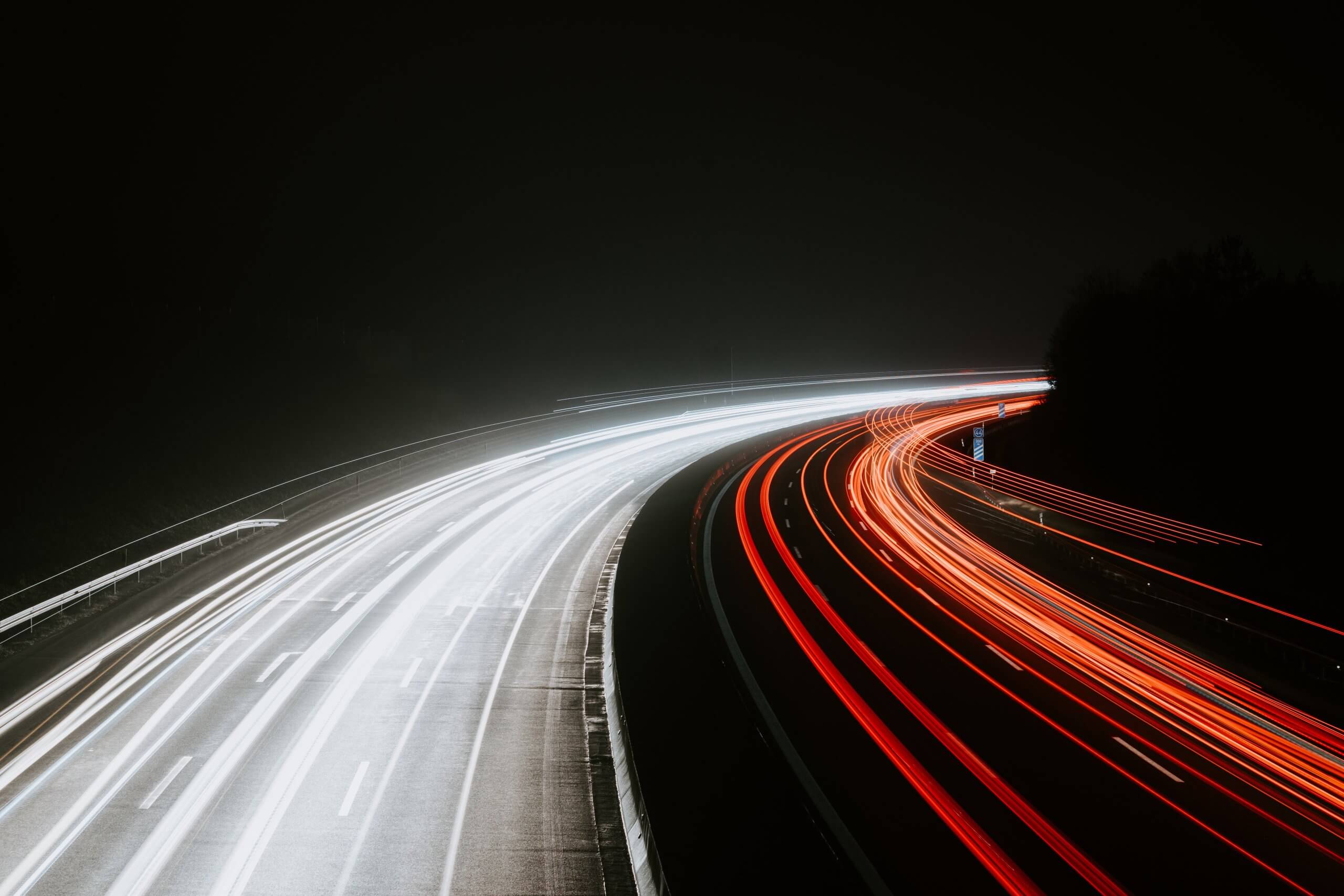 night shot of traffic flow on highway